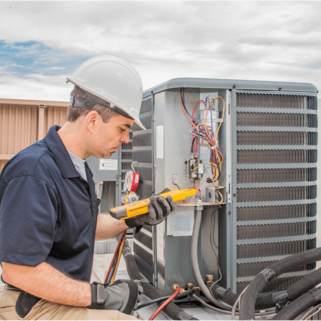 Grand Bend Heating & Cooling HVAC technician on a service call in Grand Bend, Ontario