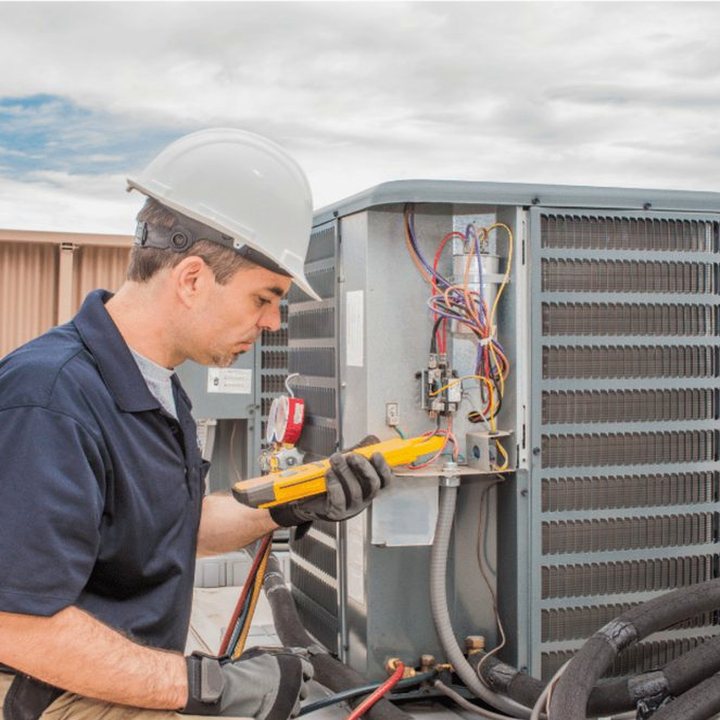 Grand Bend Heating & Cooling technician on a service call at a Lake Huron cottage